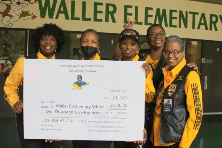 Buffalo Soldiers Motorcycle Club presenting a $1,500 donation check to Waller Elementary School